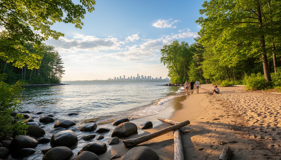 Sandy beach at Cap-Saint-Jacques Nature Park with footprints, swimmers, and trees in the background